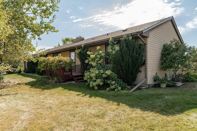 42340 County 50th Blvd, Minneola Twp, MN 55983 - view of home's exterior featuring a yard, a chimney, and a wooden deck