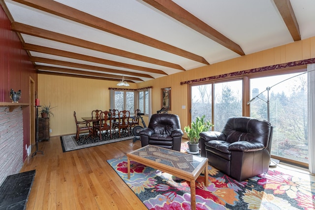 42340 County 50th Blvd, Minneola Twp, MN 55983 - living area featuring beamed ceiling, healthy amount of natural light, hardwood / wood-style flooring, and wood walls