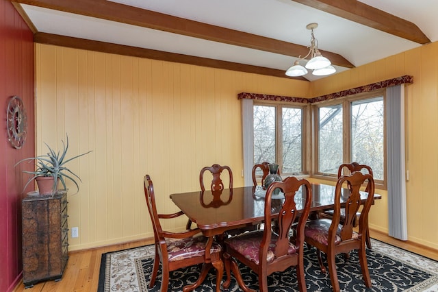 42340 County 50th Blvd, Minneola Twp, MN 55983 - dining space with beam ceiling, light wood-type flooring, wooden walls, and baseboards