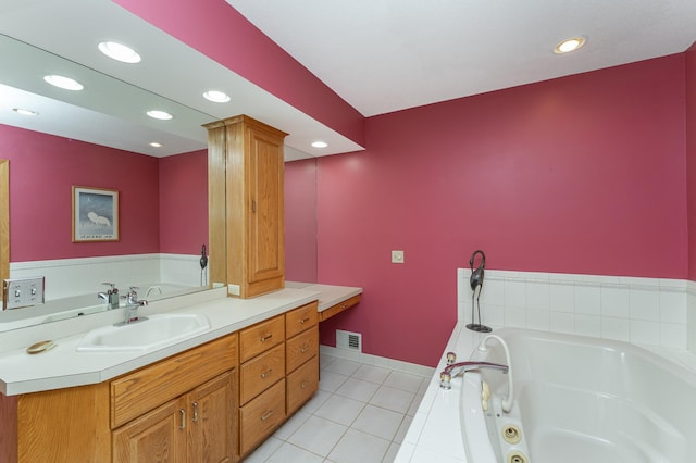 42340 County 50th Blvd, Minneola Twp, MN 55983 - full bath with a tub with jets, vanity, tile patterned flooring, recessed lighting, and baseboards