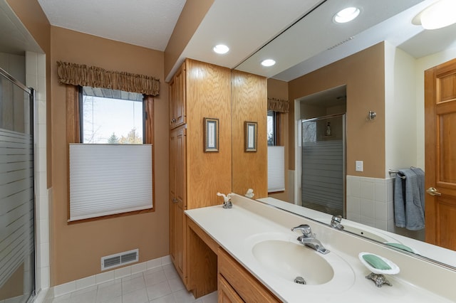 42340 County 50th Blvd, Minneola Twp, MN 55983 - full bath featuring a stall shower, vanity, recessed lighting, and tile patterned flooring