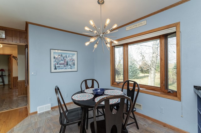42340 County 50th Blvd, Minneola Twp, MN 55983 - dining space featuring a chandelier, ornamental molding, and baseboards