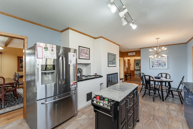 42340 County 50th Blvd, Minneola Twp, MN 55983 - kitchen featuring stainless steel fridge with ice dispenser, crown molding, dark cabinets, a chandelier, and a center island