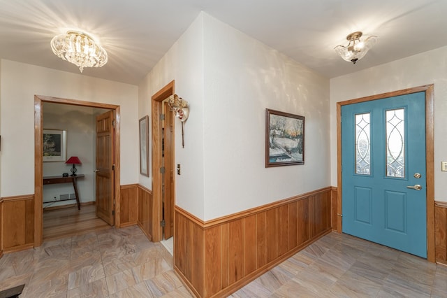 42340 County 50th Blvd, Minneola Twp, MN 55983 - foyer entrance featuring wainscoting, a chandelier, and wooden walls