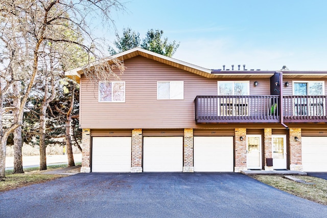 2245 Pinehurst St, Stillwater, MN 55082 - view of front facade featuring driveway, an attached garage, and a balcony