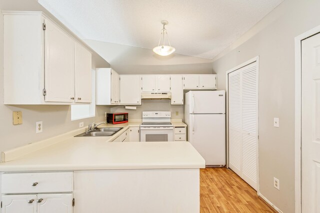 2245 Pinehurst St, Stillwater, MN 55082 - kitchen with white appliances, a sink, under cabinet range hood, a peninsula, and light wood-style floors