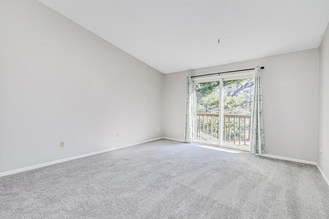 2245 Pinehurst St, Stillwater, MN 55082 - empty room with baseboards, carpet, and vaulted ceiling