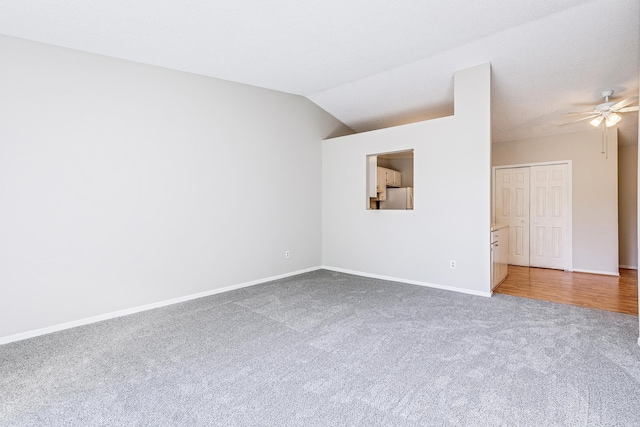 2245 Pinehurst St, Stillwater, MN 55082 - unfurnished room with carpet flooring, a ceiling fan, baseboards, and lofted ceiling