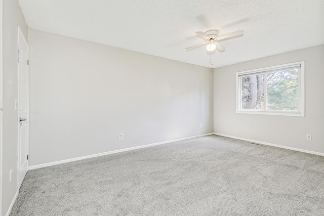 2245 Pinehurst St, Stillwater, MN 55082 - empty room featuring a ceiling fan, carpet flooring, a textured ceiling, and baseboards