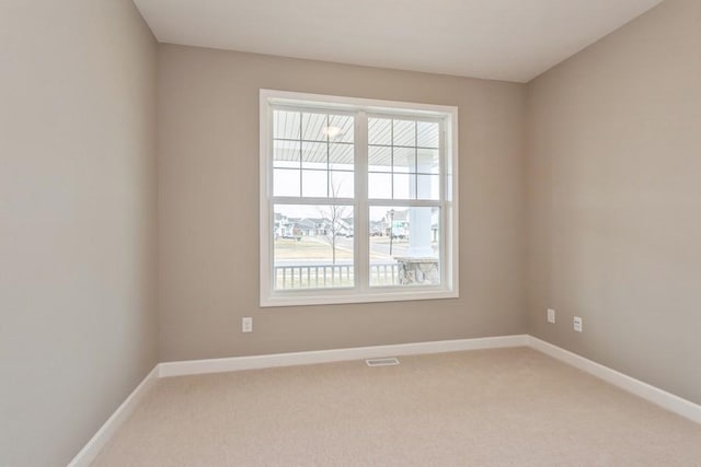 14965 105th Pl N, Maple Grove, MN 55369 - empty room featuring healthy amount of natural light, light colored carpet, and baseboards