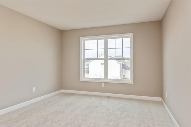 14965 105th Pl N, Maple Grove, MN 55369 - unfurnished room featuring baseboards and light colored carpet