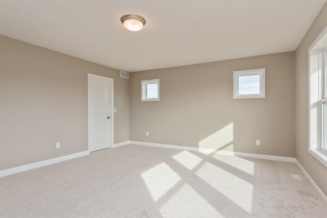 14965 105th Pl N, Maple Grove, MN 55369 - empty room with light colored carpet, plenty of natural light, and baseboards