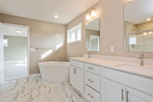 14965 105th Pl N, Maple Grove, MN 55369 - bathroom featuring marble finish flooring, a freestanding bath, a shower, double vanity, and recessed lighting