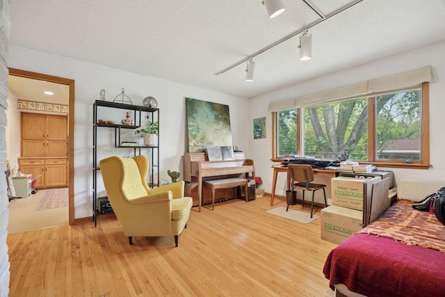 5 Hillside Ct, Northfield, MN 55057 - bedroom with light wood-style flooring, track lighting, and a textured ceiling