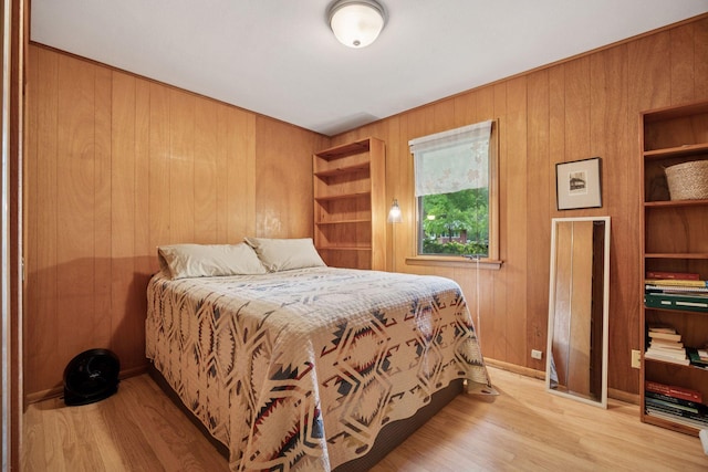 5 Hillside Ct, Northfield, MN 55057 - bedroom with wood walls and light wood-style floors