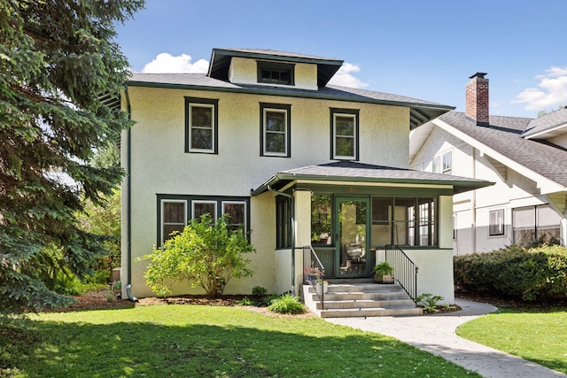 1310 Fairmount Ave, Saint Paul, MN 55105 - american foursquare style home featuring a front lawn, stucco siding, a sunroom, and roof with shingles