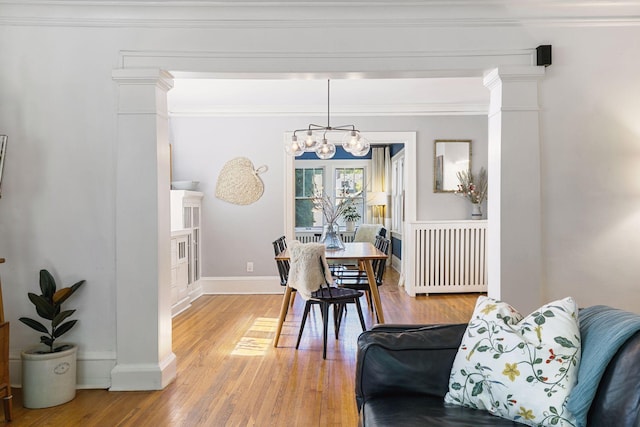 1310 Fairmount Ave, Saint Paul, MN 55105 - dining space featuring a chandelier, radiator, light wood-style floors, baseboards, and ornamental molding