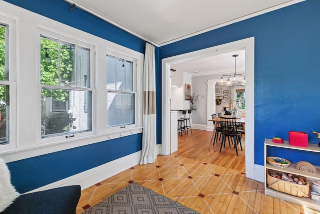 1310 Fairmount Ave, Saint Paul, MN 55105 - hall featuring ornamental molding, a chandelier, and baseboards