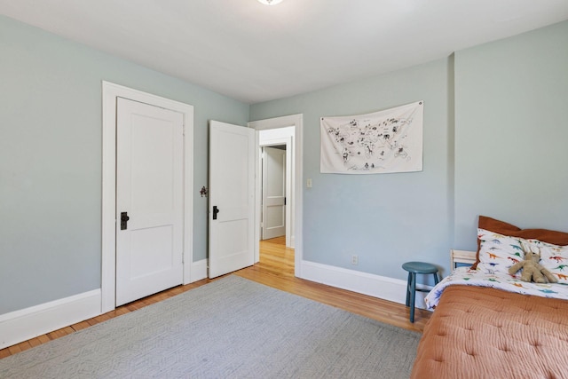 1310 Fairmount Ave, Saint Paul, MN 55105 - bedroom with baseboards and wood finished floors