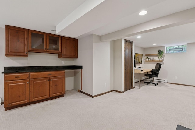 1310 Fairmount Ave, Saint Paul, MN 55105 - kitchen with light carpet, a desk, baseboard heating, glass insert cabinets, and recessed lighting