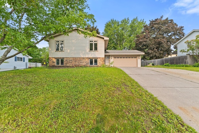 228 16th Ave SW, New Brighton, MN 55112 - split level home featuring an attached garage, concrete driveway, and brick siding