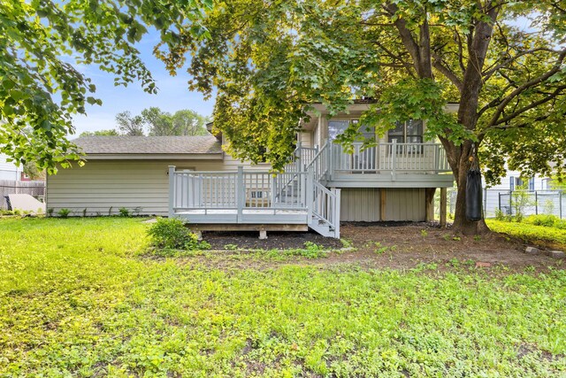 228 16th Ave SW, New Brighton, MN 55112 - rear view of property with a wooden deck, stairs, and a shingled roof