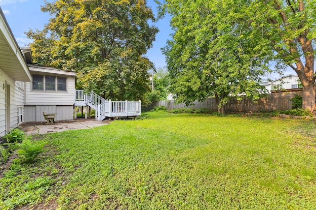 228 16th Ave SW, New Brighton, MN 55112 - view of yard featuring a deck and a patio area