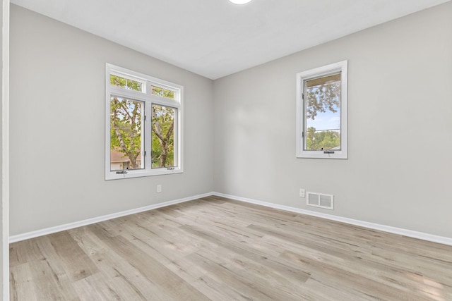 228 16th Ave SW, New Brighton, MN 55112 - empty room featuring light wood finished floors and baseboards