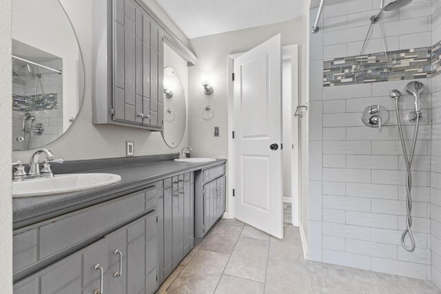 228 16th Ave SW, New Brighton, MN 55112 - bathroom with double vanity, tiled shower, and tile patterned floors