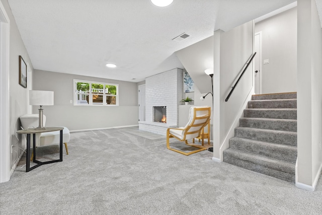 228 16th Ave SW, New Brighton, MN 55112 - carpeted living room featuring stairway, a brick fireplace, and baseboards