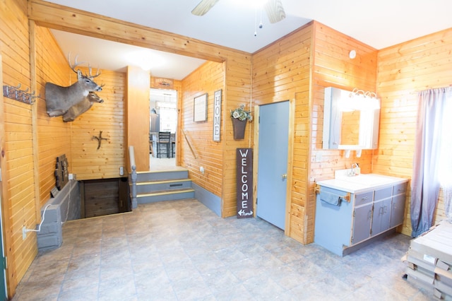 2758 220th St, Madison, MN 56256 - interior space featuring wooden walls, ceiling fan, and beamed ceiling