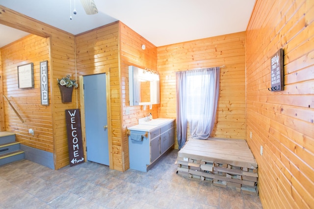 2758 220th St, Madison, MN 56256 - bathroom featuring wood walls and vanity