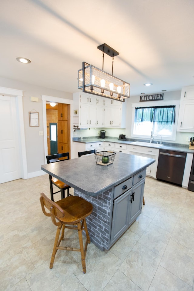 2758 220th St, Madison, MN 56256 - kitchen featuring stainless steel dishwasher, white cabinetry, dark countertops, a breakfast bar, and recessed lighting