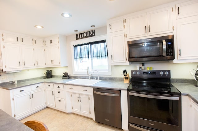 2758 220th St, Madison, MN 56256 - kitchen featuring stainless steel appliances, a sink, white cabinetry, and recessed lighting