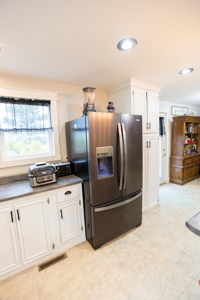 2758 220th St, Madison, MN 56256 - kitchen featuring stainless steel fridge, white cabinetry, dark countertops, and recessed lighting