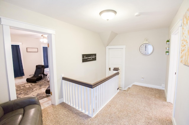 2758 220th St, Madison, MN 56256 - corridor with an upstairs landing, baseboards, and carpet floors