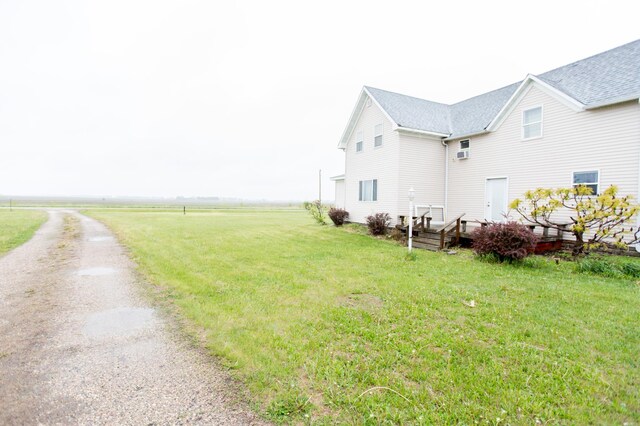 2758 220th St, Madison, MN 56256 - view of side of home featuring a lawn and a deck