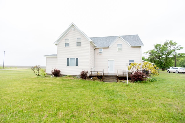2758 220th St, Madison, MN 56256 - rear view of house with a lawn, a deck, and a shingled roof