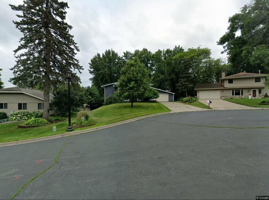 708 Brigadoon Cir, Shoreview, MN 55126 - view of front of property featuring a garage and a front yard