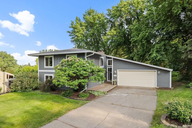 708 Brigadoon Cir, Shoreview, MN 55126 - view of front of home featuring board and batten siding, a front yard, a chimney, driveway, and an attached garage