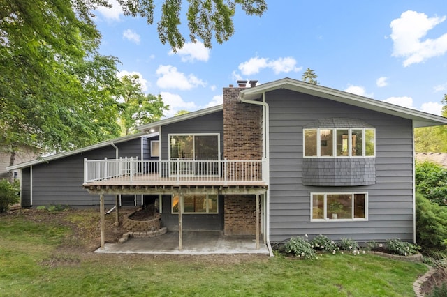 708 Brigadoon Cir, Shoreview, MN 55126 - back of house with a patio area, a wooden deck, a yard, and a chimney