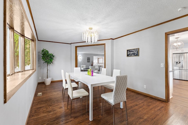 708 Brigadoon Cir, Shoreview, MN 55126 - dining space with a chandelier, ornamental molding, dark wood-style floors, a textured ceiling, and baseboards