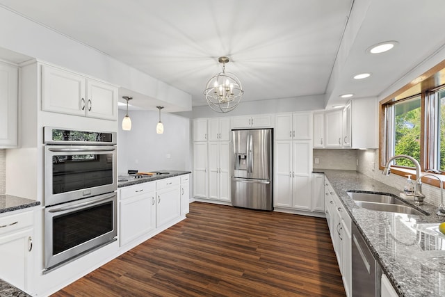 708 Brigadoon Cir, Shoreview, MN 55126 - kitchen featuring appliances with stainless steel finishes, a sink, white cabinets, tasteful backsplash, and recessed lighting