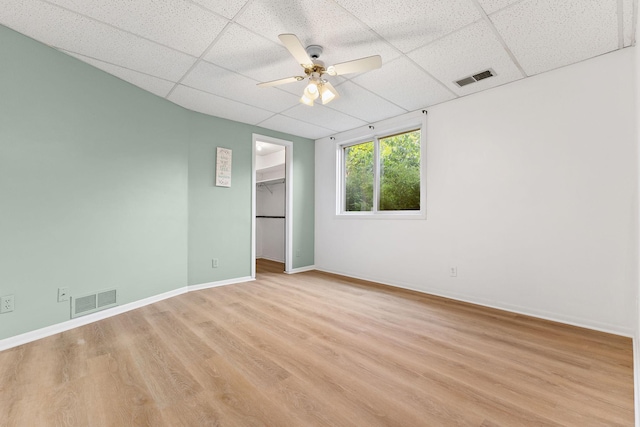 708 Brigadoon Cir, Shoreview, MN 55126 - empty room with a drop ceiling, light wood-type flooring, a ceiling fan, and baseboards