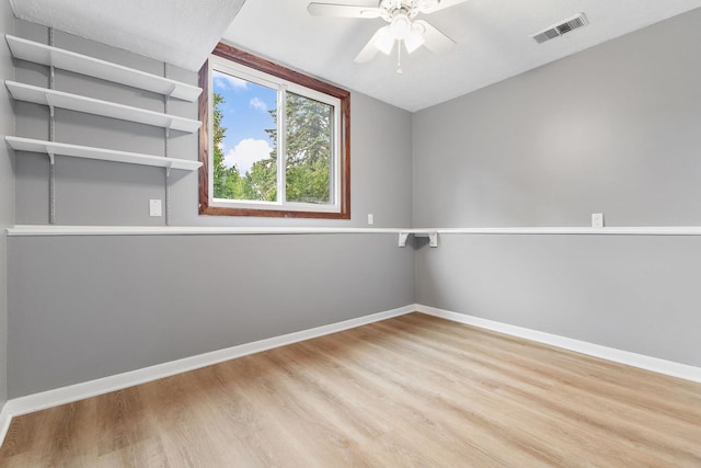 708 Brigadoon Cir, Shoreview, MN 55126 - empty room with wood finished floors, ceiling fan, baseboards, and vaulted ceiling