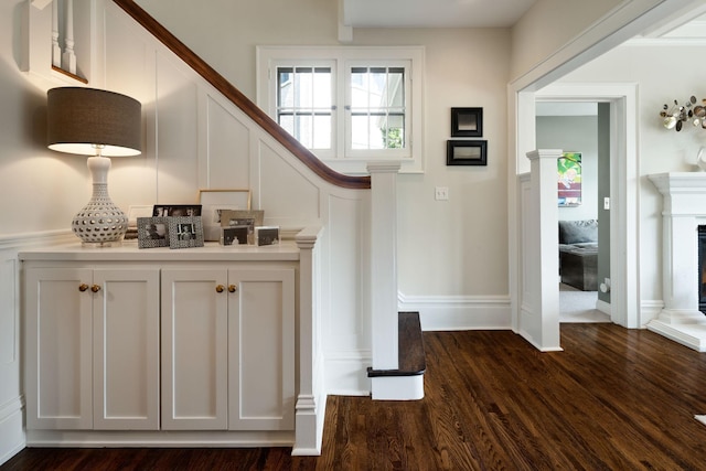 1824 Oliver Ave S, Minneapolis, MN 55405 - staircase featuring wood finished floors, a fireplace with raised hearth, and baseboards