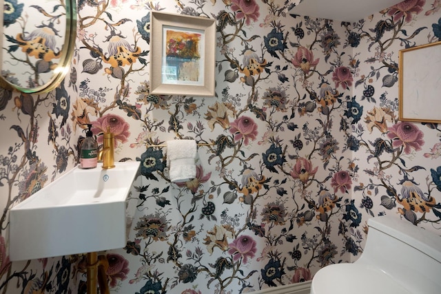 1824 Oliver Ave S, Minneapolis, MN 55405 - bathroom featuring wallpapered walls, toilet, and a sink