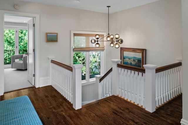 1824 Oliver Ave S, Minneapolis, MN 55405 - staircase featuring wood finished floors, a chandelier, and baseboards