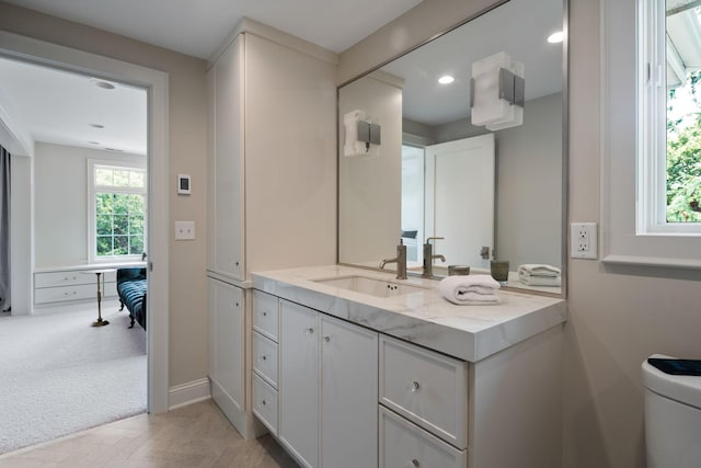 1824 Oliver Ave S, Minneapolis, MN 55405 - bathroom featuring vanity, toilet, recessed lighting, and baseboards
