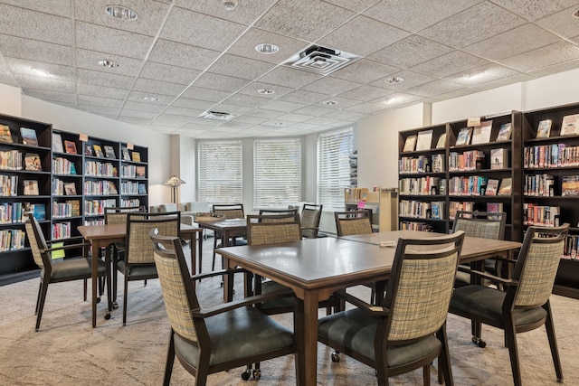 1425 28th St Unit 519, Minneapolis, MN 55408 - dining space with carpet floors and a drop ceiling